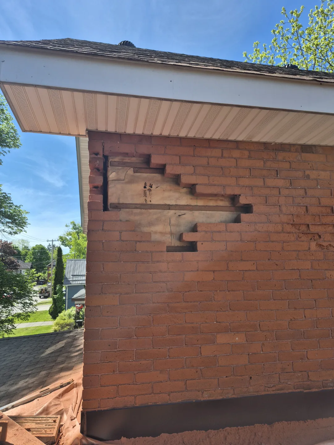 Damaged bricks removed from a century home wall before replacement
